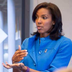Erika James is speaking in business setting