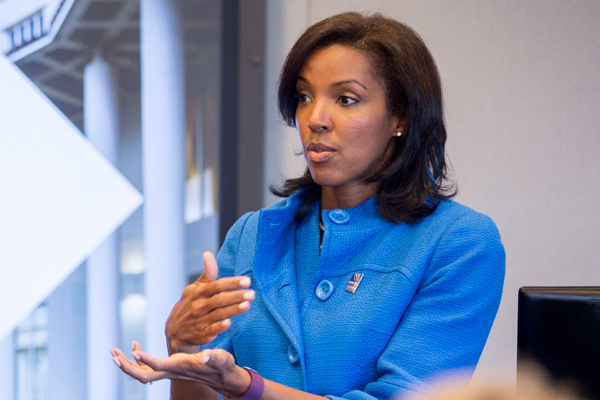 Erika James is speaking in business setting