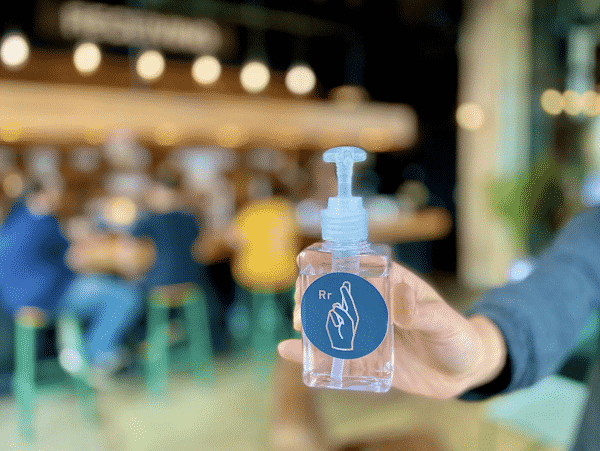 Woman using antibacterial hand sanitizer, closeupn using antibacterial hand sanitizer, closeup