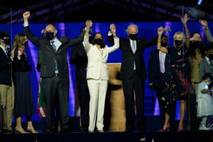Kamala HArris and Joe Biden on stage with their team