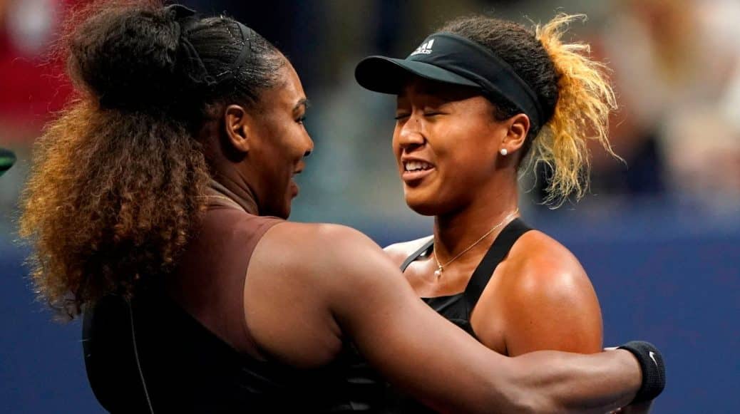 Serena Williams and Naomi Osaka hugging after a tennis match