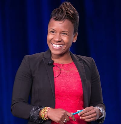 Stephanie Lampkin, founder and CEO of Blendoor, pictured in a red dress and black blazer