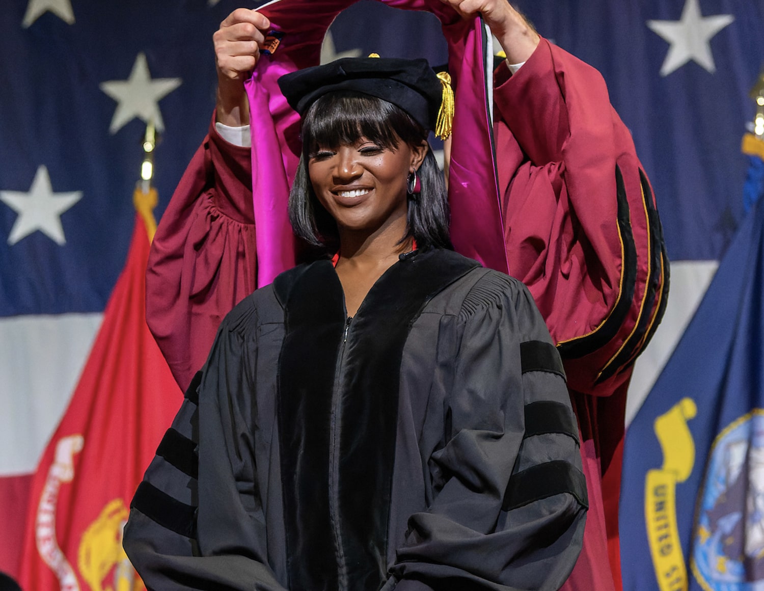 Deshauna Barber receives her Honorary Doctorate after giving the commencement speech at Norwich University's spring 2022 graduation